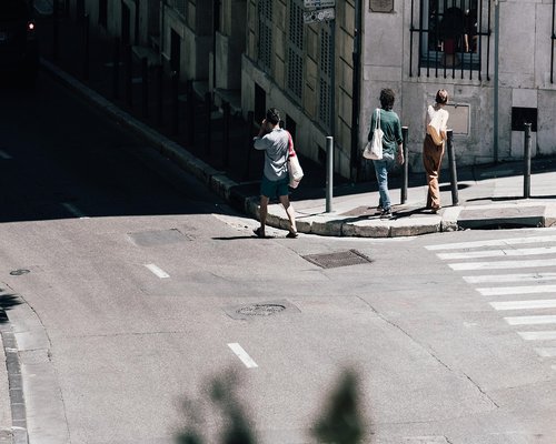 A person walking comfortably on a city pavement
